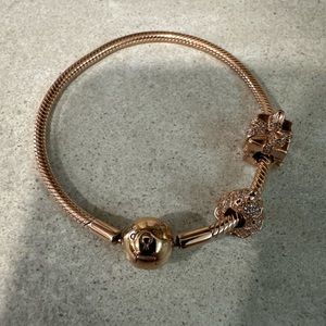 Pandora Rose Gold Bracelet with Charms.